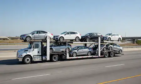 Multi-level car carrier on the highway to Hattiesburg, Mississippi, United States