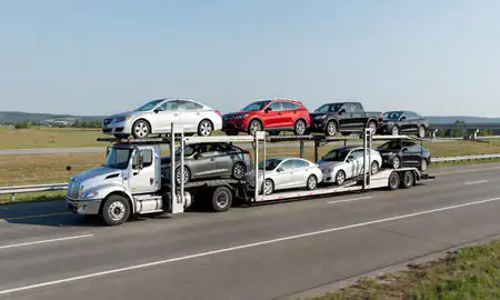 Multi-level car carrier on the highway to Hernando, Mississippi, United States