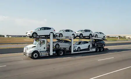 Multi-level car carrier on the highway to Jackson, Mississippi, United States