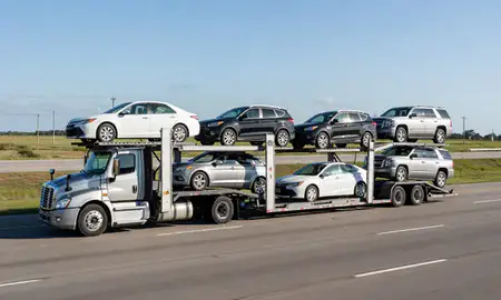 Multi-level car carrier on the highway to Long Beach, Mississippi, United States