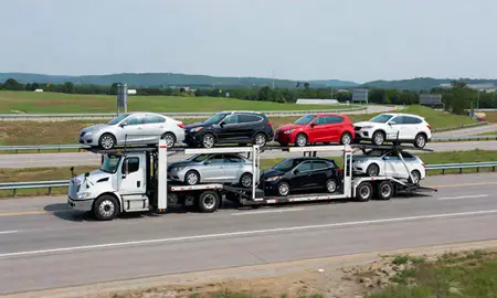 Multi-level car carrier on the highway to Madison, Mississippi, United States