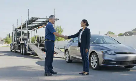 Vehicle owner beside their delivered car in Madison, Mississippi, United States