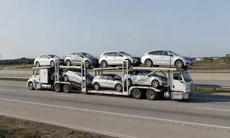 Multi-level car carrier on the highway to Ocean Springs, Mississippi, United States