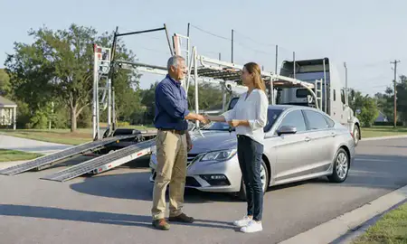Vehicle owner beside their delivered car in Ocean Springs, Mississippi, United States