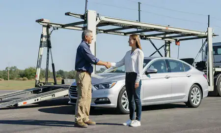 Vehicle owner beside their delivered car in Olive Branch, Mississippi, United States