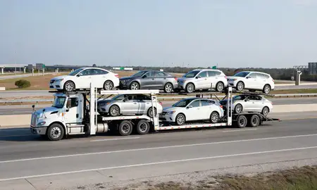 Multi-level car carrier on the highway to Pascagoula, Mississippi, United States