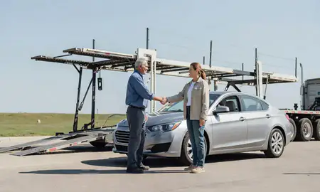 Vehicle owner beside their delivered car in Southaven, Mississippi, United States