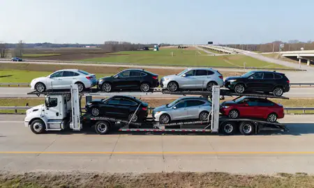 Multi-level car carrier on the highway to Starkville, Mississippi, United States