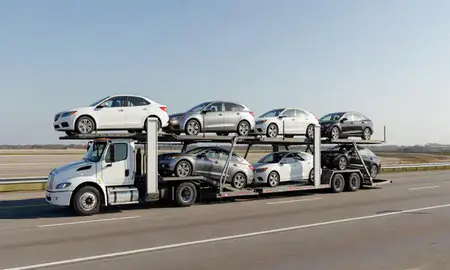 Multi-level car carrier on the highway to Vicksburg, Mississippi, United States