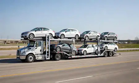Multi-level car carrier on the highway to Belton, Missouri, United States