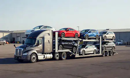 Car transporter loaded with vehicles in Belton, Missouri, United States