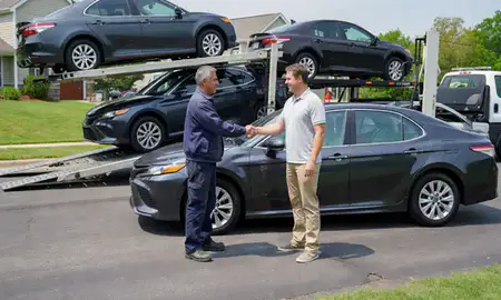 Vehicle owner beside their delivered car in Blue Springs, Missouri, United States