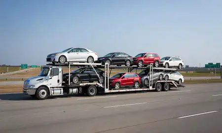 Multi-level car carrier on the highway to Cape Girardeau, Missouri, United States