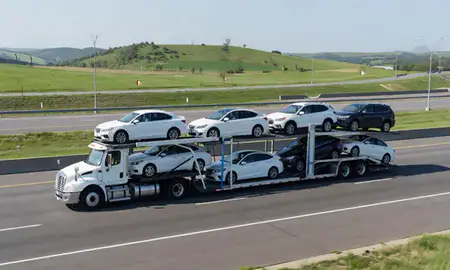 Multi-level car carrier on the highway to Columbia, Missouri, United States
