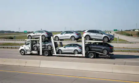 Multi-level car carrier on the highway to Florissant, Missouri, United States