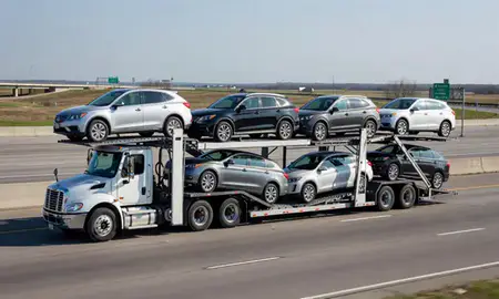 Multi-level car carrier on the highway to Gladstone, Missouri, United States
