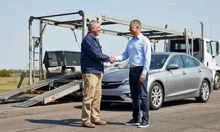 Vehicle owner beside their delivered car in Gladstone, Missouri, United States