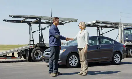 Vehicle owner beside their delivered car in Grandview, Missouri, United States