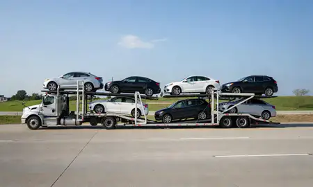 Multi-level car carrier on the highway to Hazelwood, Missouri, United States