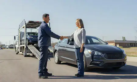 Vehicle owner beside their delivered car in Hazelwood, Missouri, United States