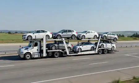 Multi-level car carrier on the highway to Independence, Missouri, United States
