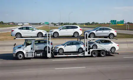 Multi-level car carrier on the highway to Kansas City, Missouri, United States