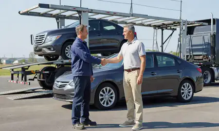 Vehicle owner beside their delivered car in Maryland Heights, Missouri, United States