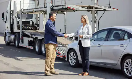 Vehicle owner beside their delivered car in Mehlville, Missouri, United States