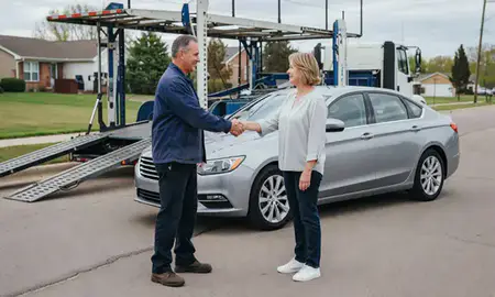 Vehicle owner beside their delivered car in Oakville, Missouri, United States