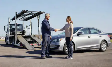 Vehicle owner beside their delivered car in St. Joseph, Missouri, United States