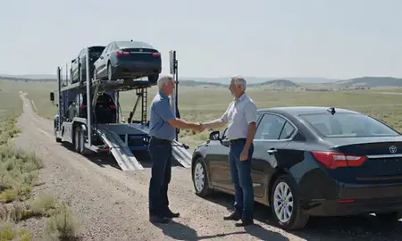 Vehicle owner beside their delivered car in Montana, United States