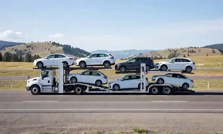 Multi-level car carrier on the highway to Bigfork, Montana, United States
