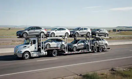 Multi-level car carrier on the highway to Billings, Montana, United States