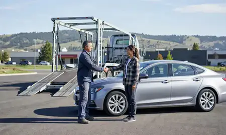 Vehicle owner beside their delivered car in Bozeman, Montana, United States