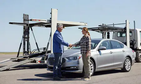 Vehicle owner beside their delivered car in Columbia Falls, Montana, United States