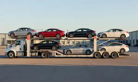 Car transporter parked in an industrial area of Columbia Falls, Montana, United States