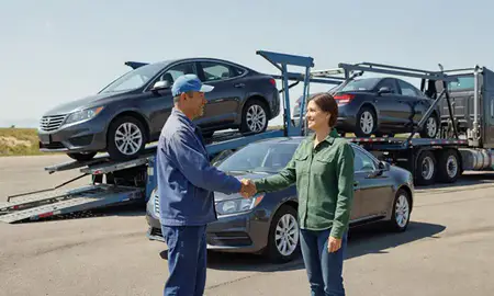 Vehicle owner beside their delivered car in Evergreen, Montana, United States