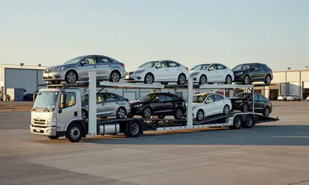 Car transporter loaded with vehicles in Four Corners, Montana, United States