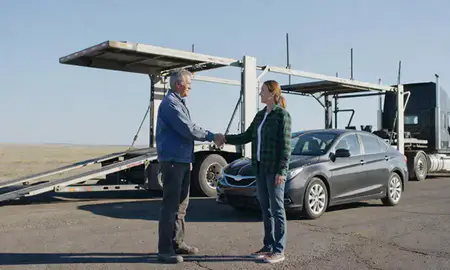 Vehicle owner beside their delivered car in Glendive, Montana, United States