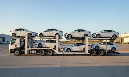 Car transporter parked in an industrial area of Glendive, Montana, United States