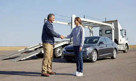Vehicle owner beside their delivered car in Hamilton, Montana, United States