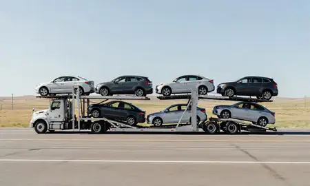 Multi-level car carrier on the highway to Havre, Montana, United States