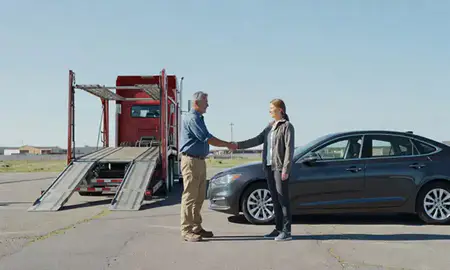 Vehicle owner beside their delivered car in Havre, Montana, United States