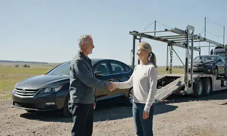 Vehicle owner beside their delivered car in Helena Valley Northwest, Montana, United States
