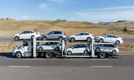 Multi-level car carrier on the highway to Helena, Montana, United States