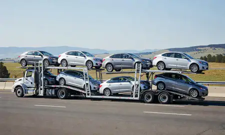 Multi-level car carrier on the highway to Kalispell, Montana, United States