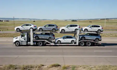 Multi-level car carrier on the highway to Laurel, Montana, United States