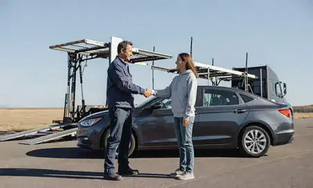 Vehicle owner beside their delivered car in Laurel, Montana, United States