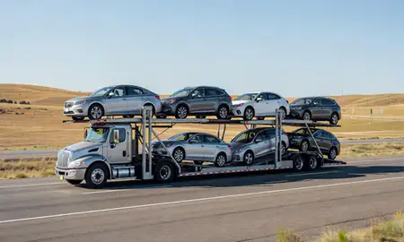Multi-level car carrier on the highway to Lewistown, Montana, United States