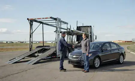 Vehicle owner beside their delivered car in Lewistown, Montana, United States
